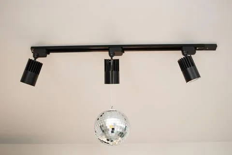 Track light disco ball on the ceiling Stock Photos