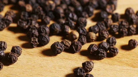 Track over black peppercorns on kitchen counter Stock Footage 56090523