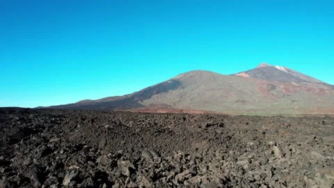 Track over lold lava flow towards dormant volcano Stock-Footage 231779626