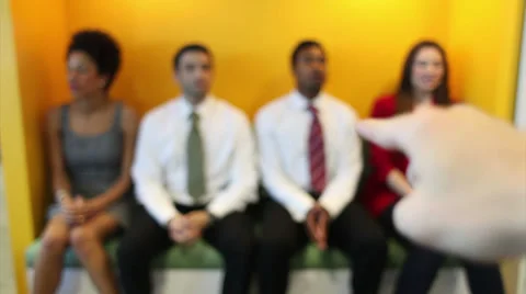 Track past group of professionals with one individual standing out from the Vídeo Stock 32743959