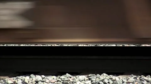 A track rail bending under the weight of a passing train Stock Footage 136905462