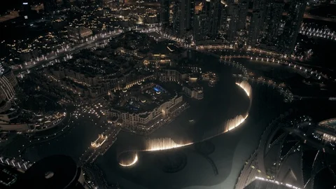 Track right at 300m looking down at Dubai Fountains from Burj Khalifa side, Stock Footage 98962410