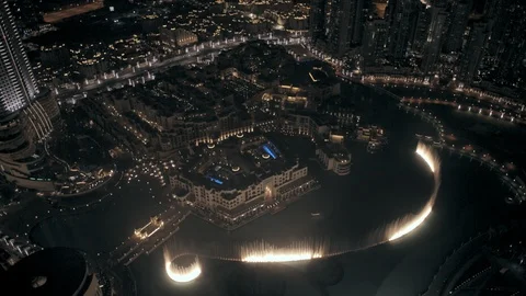 Track right at 300m looking down at Dubai Fountains from Burj Khalifa side, Stock Footage 98962806