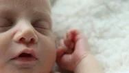 Track Right To Left Over A Sleeping Caucasian Newborn's Face With A Smile  Stock Footage