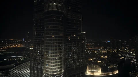 Track right while descending from 150m down to 100m from Burj Kahlifa to reveal Stock Footage 98959955