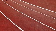 Track Runners Man And Woman Running On Stadium, Low Angle, Slow Motion Stock Footage