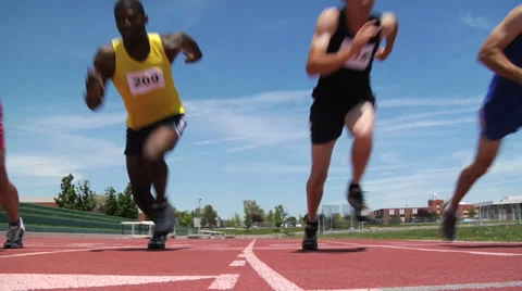 Track runners start race Stock Footage