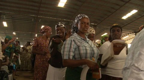 Track through singing congregation, Nigerian mega church Stock Footage 38476758