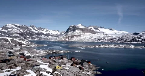 Track in toward settlement in Eastern Greenland Stock Footage 138240343