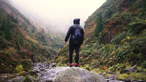 Track trail through mountains walking by muddy paths after rain amidst nature Video stock 237691355