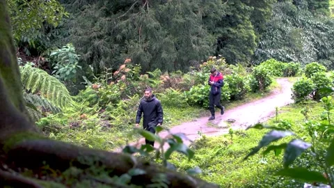 Track trail through mountains walking by muddy paths after rain amidst nature 스톡 동영상 237691494