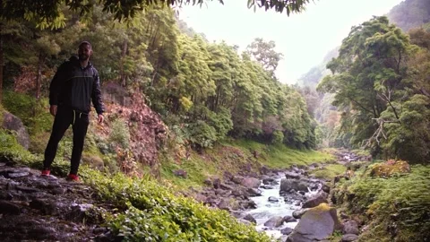 Track trail through mountains walking by muddy paths after rain amidst nature Stock Footage 237692105