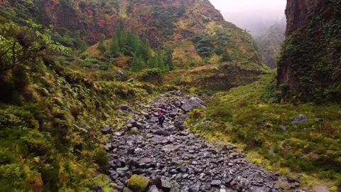 Track trail through mountains walking by muddy paths after rain amidst nature Vídeos de archivo 237692170