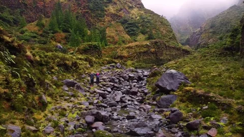 Track trail through mountains walking by muddy paths after rain amidst nature Vídeos de archivo 237692179