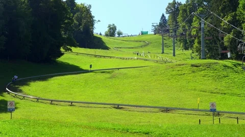 A track where sleds go down the mountainside on Lake Bled, Slovenia. Stock Footage 317913348