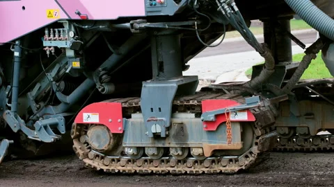 Tracked construction machine, asphalt paver or road milling machine, operate on Stock Footage 309597186