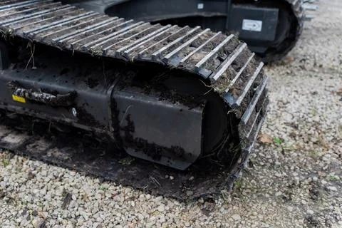 Tracked construction machine with dirty rubber belt Stock Photos