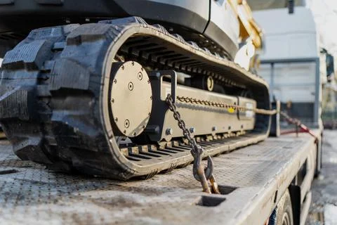 Tracked construction machine with rubber crawler Stock Photos