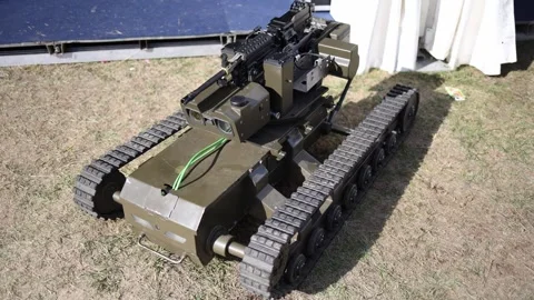 Tracked military robot with machine gun and optical targeting sensors Stock Footage 346451637