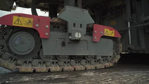 Tracked road milling machine in motion on the road. closeup Stock Footage 145466042