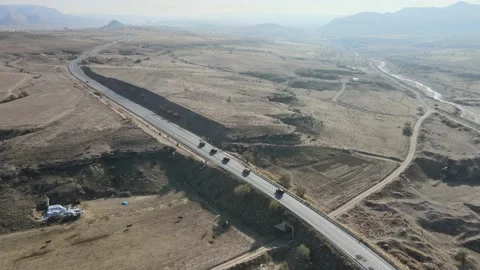 Tracking 4K Drone View 4X4 Vehicle Driving On Road And Landscape Cappadocia Stock Footage 169454725