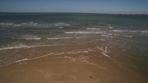 Tracking aerial of beach waves Stock Footage 78407874