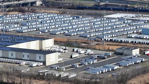 Tracking aerial over FedEx Trailer Yard and Solar Array, Jersey City Stock Footage 344596509