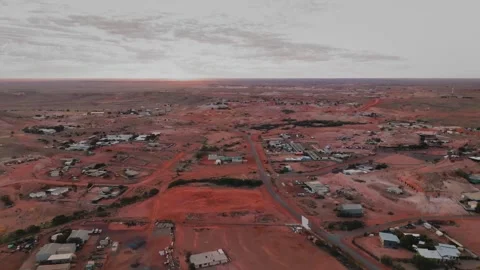 Tracking aerial shot over outback opal mining town Stock Footage 292983431