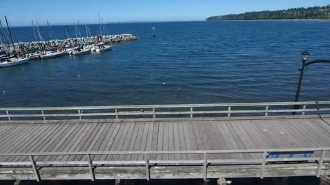 Tracking along a Pier out to sea. Stock Footage 96549953