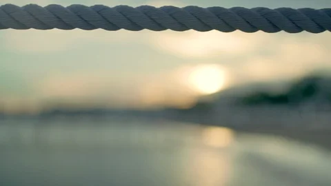 Tracking along quay side rope on beach. Seaside and coastal view. Stock-Footage 88871221