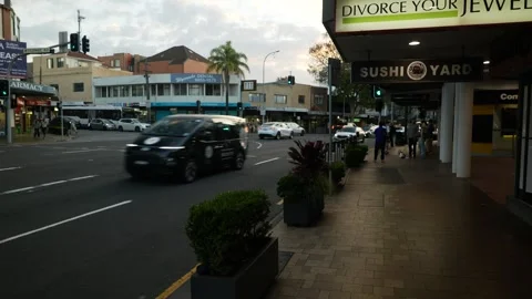 Tracking and pan Sydney traffic and pedestrians in Cremorne early evening Video stock 307835297