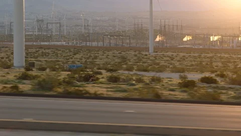 Tracking a biker riding fast at sunset Stock Footage 106474828