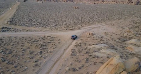 Tracking black SUV in the desert Stock Footage 77702646