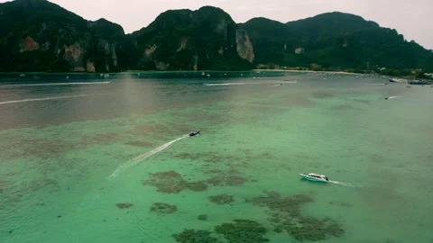 Tracking a boat on the drone of Phi Phi Phi Island Stock Footage 232717976
