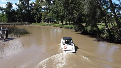 Tracking Boat in small river Stock Footage 148697285