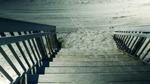 Tracking Clip Down the Boardwalk Steps and onto the Jersey Shore Stock Footage 63080380
