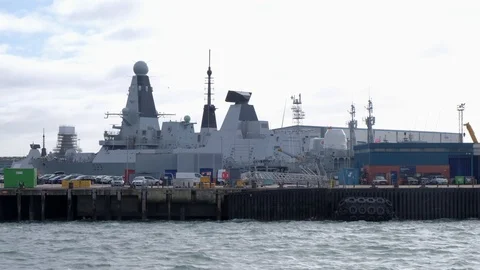 Tracking clip of Royal Navy type 45 destroyers in dry dock Video stock 125611234