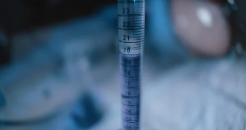 Tracking close up shot of purple liquid being put into a conical flask. Stock Footage 121090185