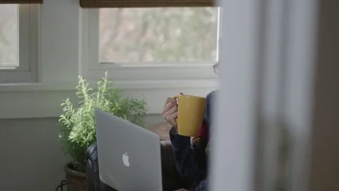 Tracking close up shot of a young lady shopping on a computer Stock Footage 70809603