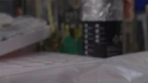 Tracking close up view artists hand carefully pour white consistency material Stock Footage 157007361