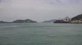 Tracking Coastal Sea Waters And Industiral Ship At Seaport Island Of Naoshima HD HD Footage