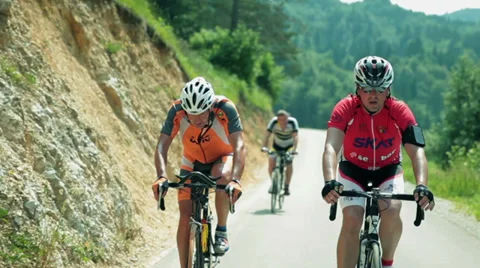Tracking a cyclist through countryside Stock Footage 31581823