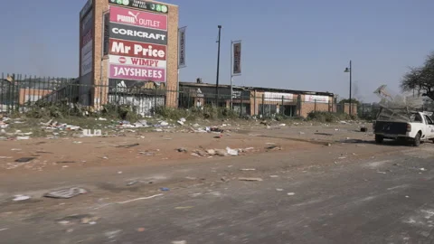 Tracking damage along a road after looting in Durban. Video stock 170952163