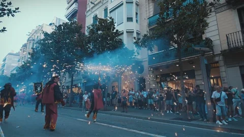 Tracking Diables Dancing With Sparking Tridents at Correfoc, Gràcia Barcelona Stock Footage 319515411