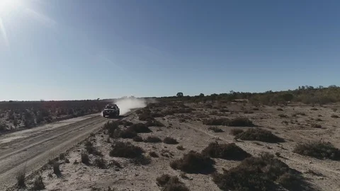Tracking different angles of ute driving on dusty road Stock Footage 92523302