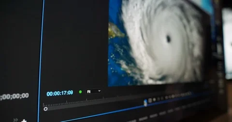 Tracking Dolly Closeup Shot of Video Editor and Hurricane Vídeos de archivo 92927702
