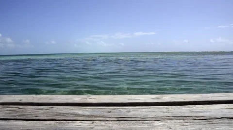 Tracking Dolly shot of Caribbean ocean from pier Stock Footage 48692338
