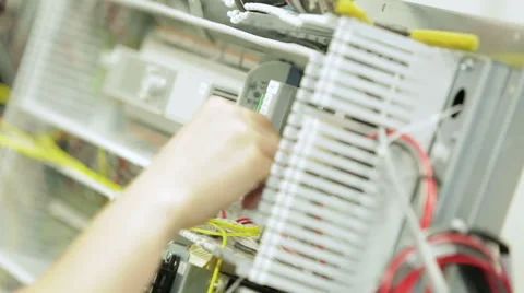 Tracking (dolly) shot of a work bench in an electronics factory 스톡 동영상 49366137