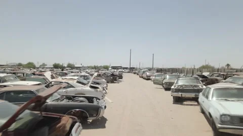 Tracking down a row of 70s junk cars Stock-Footage 192584202