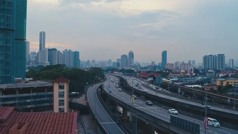 Tracking drone KL city centre sunset with highway Stock Footage 87500957